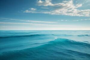 blue ocean with mountains and clouds photo