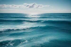 blue ocean with mountains and clouds photo