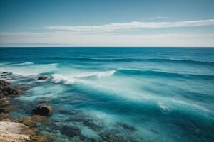 blue ocean with clouds and sun in the sky photo