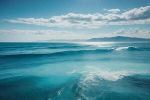 blue ocean with clouds and sun in the sky photo