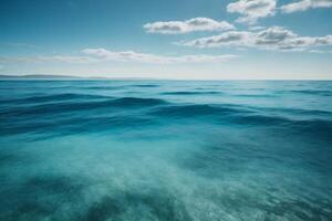 blue ocean with clouds and sun in the sky photo