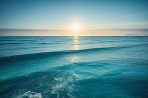 a beautiful beach with waves and blue sky photo