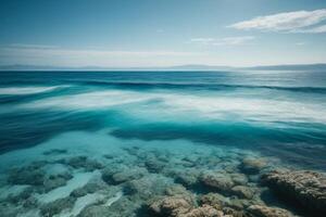 a beautiful beach with waves and blue sky photo