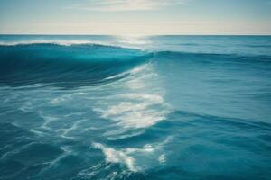 a beautiful beach with waves and blue sky photo