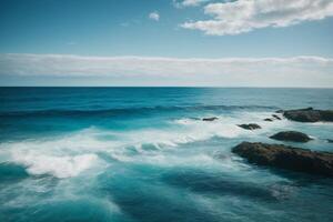 blue ocean with clouds and sun in the sky photo