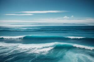 a beautiful beach with waves and blue sky photo