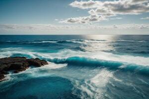 a beautiful beach with waves and blue sky photo