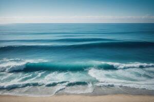 a beautiful beach with waves and blue sky photo