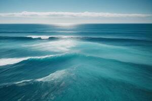 a beautiful beach with waves and blue sky photo