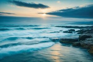 a beautiful beach with waves and blue sky photo