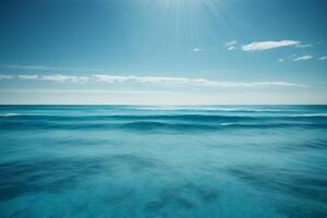 a beautiful beach with waves and blue sky photo