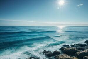 a beautiful beach with waves and blue sky photo