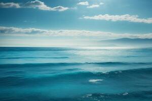 a beautiful beach with waves and blue sky photo