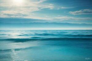 a beautiful beach with waves and blue sky photo