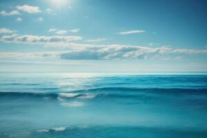 a beautiful beach with waves and blue sky photo