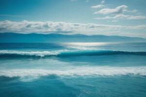 a beautiful beach with waves and blue sky photo