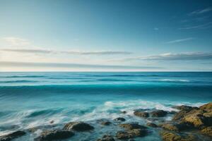 a beautiful beach with waves and blue sky photo