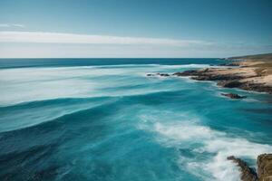 a view of the ocean from above with waves photo