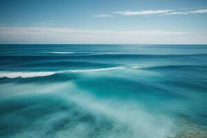 blue ocean waves and sun rays in the ocean photo