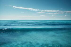 blue ocean waves and sun rays in the ocean photo