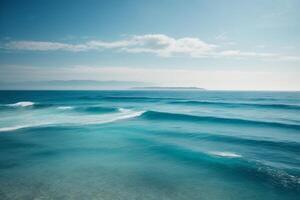 blue ocean waves and sun rays in the ocean photo