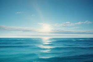 blue ocean waves and sun rays in the ocean photo