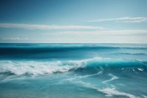 blue ocean waves and sun rays in the ocean photo