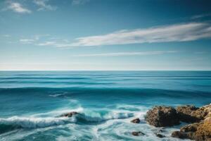 blue ocean waves and sun rays in the ocean photo