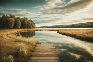 a wooden dock in front of a lake with trees photo