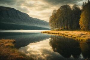 a mountain and lake are reflected in the water photo