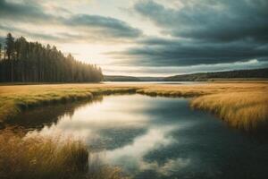 a lake surrounded by trees and a cloudy sky photo