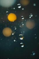 raindrops on a street in the city at night photo