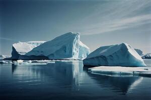 icebergs floating in the water at sunset photo