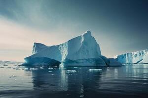 icebergs floating in the water at sunset photo