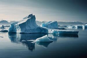 icebergs float in the water at sunset photo