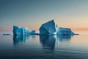 icebergs floating in the water at sunset photo