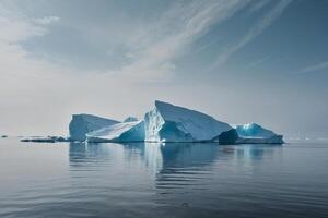 icebergs floating in the water at sunset photo