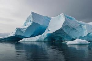 icebergs in the water with a cloudy sky photo