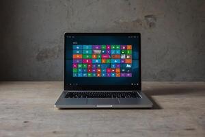 a laptop with many different icons on it photo