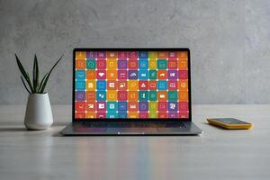 a laptop with many colorful app icons coming out of it photo