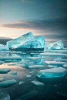 icebergs floating in the water under a colorful sky photo