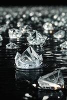 diamonds on a black surface with water photo