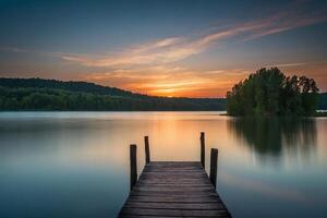 un muelle en un lago a puesta de sol foto