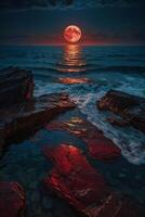 a full moon rises over the ocean and rocks photo