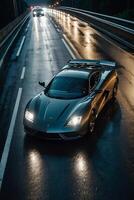 a sports car driving on a wet road at night photo