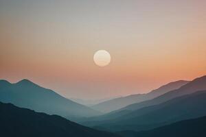 a beautiful sunset over the mountains with a large moon photo