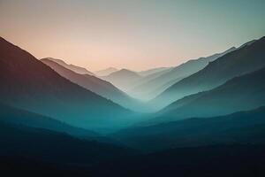 a mountain range with a sunset in the background photo