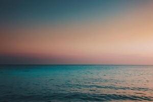 the sun setting over the ocean in a tropical beach photo