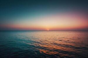 the sun setting over the ocean in a tropical beach photo