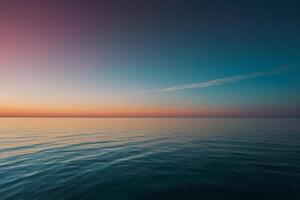 the sun setting over the ocean in a tropical beach photo